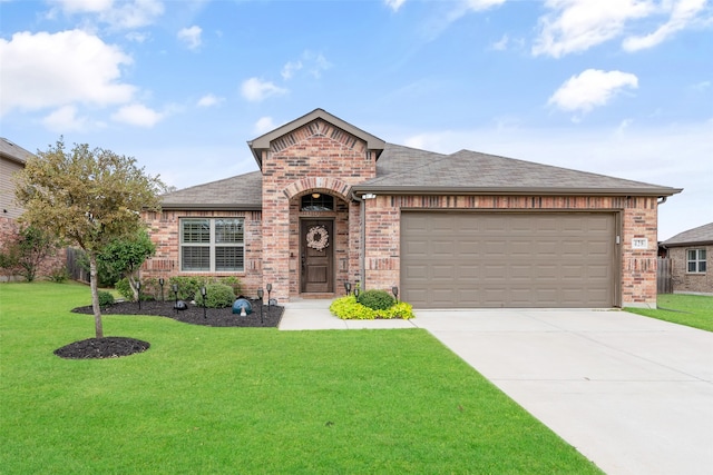 view of front of home featuring a garage and a front lawn