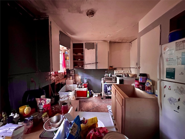 kitchen featuring white refrigerator