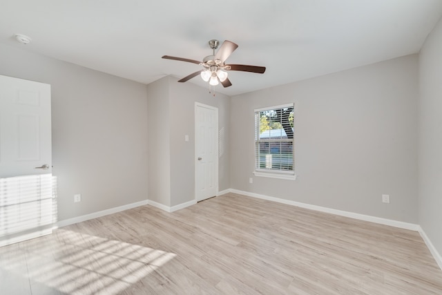 empty room featuring light hardwood / wood-style flooring and ceiling fan