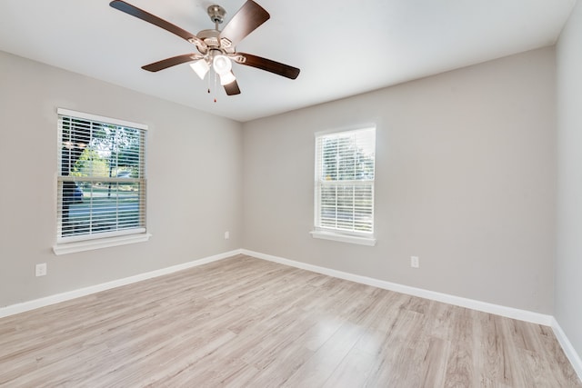 unfurnished room with light wood-type flooring and ceiling fan