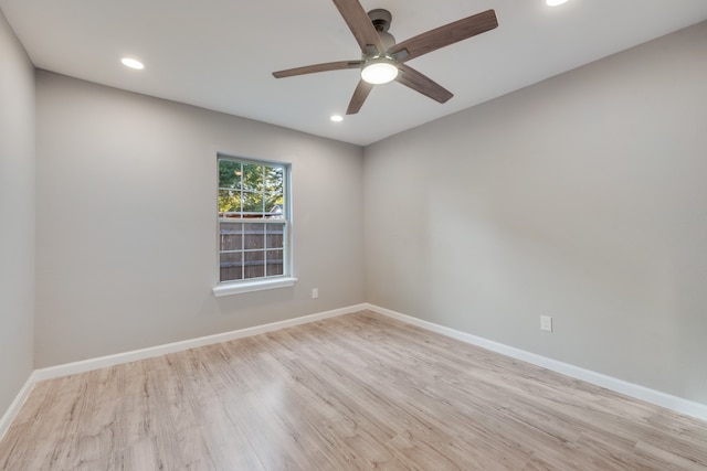 spare room with ceiling fan and light hardwood / wood-style flooring