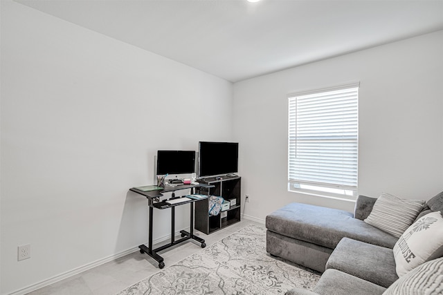 office area with light tile patterned floors and plenty of natural light