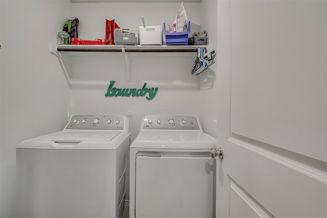 washroom with washing machine and dryer