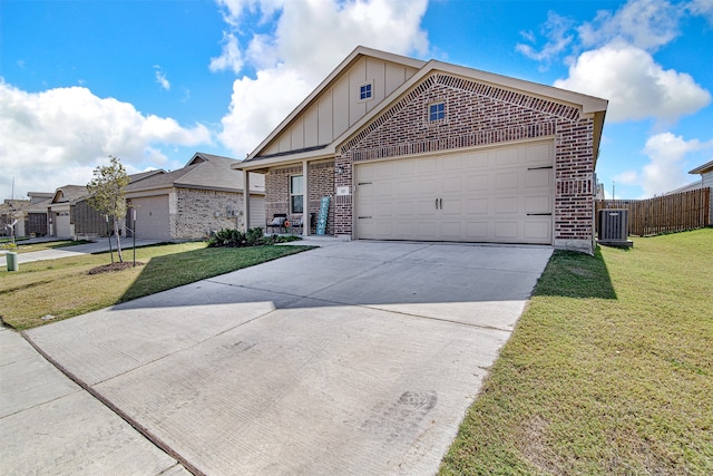 view of front of property with a front lawn and a garage