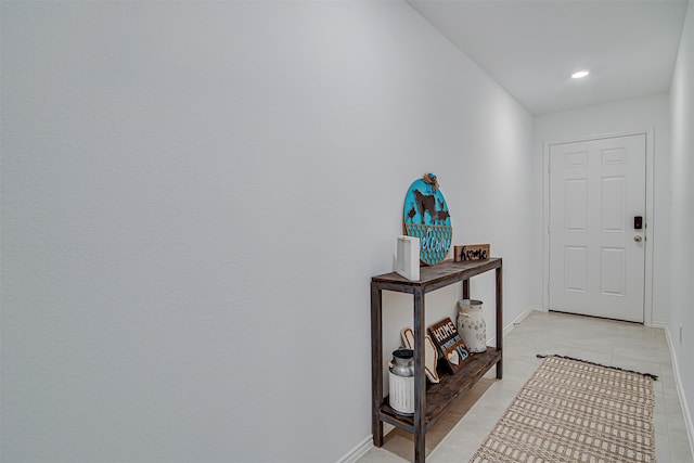 entryway featuring light tile patterned floors