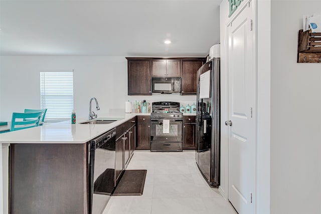 kitchen with kitchen peninsula, dark brown cabinets, light tile patterned floors, black appliances, and sink