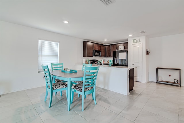 dining area with light tile patterned flooring