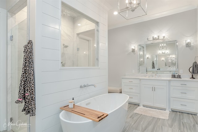 bathroom with vanity, separate shower and tub, a chandelier, and crown molding