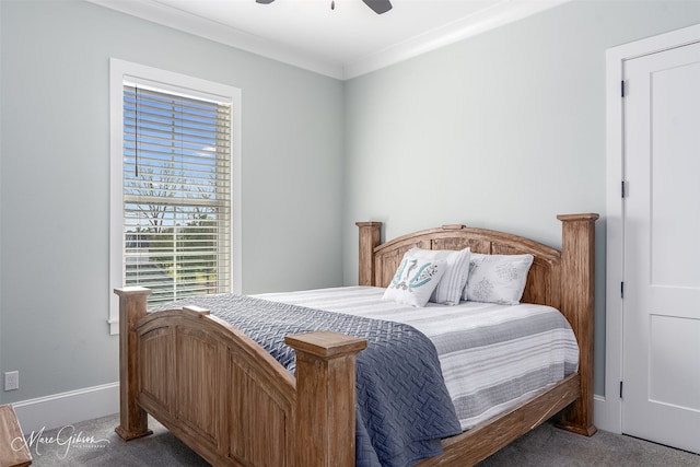 carpeted bedroom with ceiling fan and ornamental molding