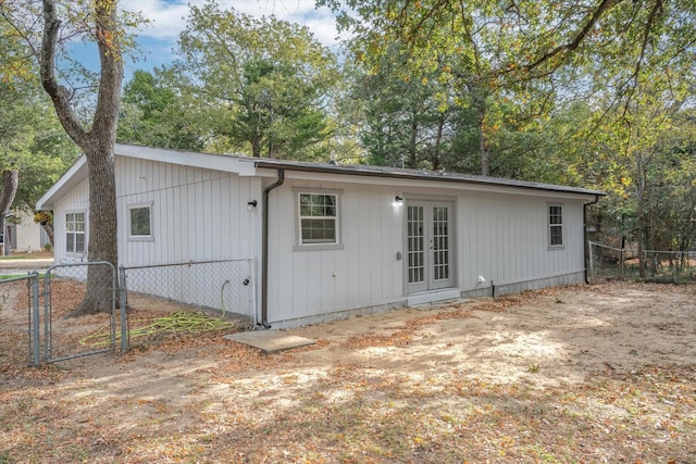 back of property featuring french doors