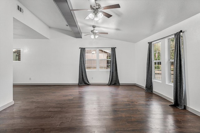 empty room with ceiling fan, dark wood-type flooring, and lofted ceiling with beams