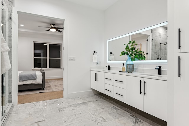 bathroom featuring vanity, ceiling fan, and a shower with door