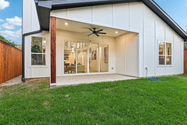 back of property featuring a patio, a yard, and ceiling fan