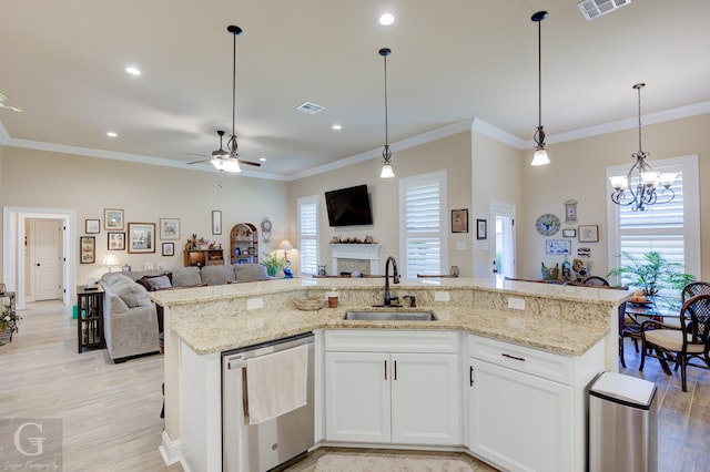 kitchen with white cabinetry, ornamental molding, sink, and stainless steel dishwasher