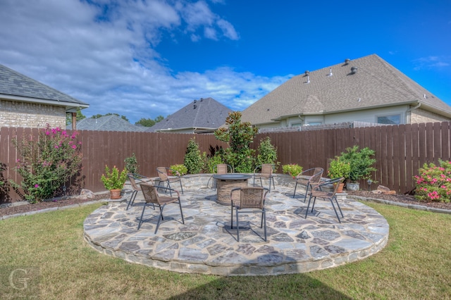 view of patio / terrace featuring an outdoor fire pit