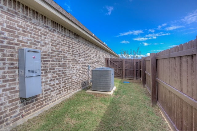 view of yard featuring central air condition unit