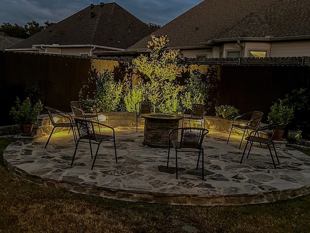 view of patio / terrace with an outdoor fire pit