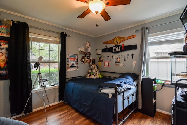 2725 S 40th St, Abilene, TX 79605 - bedroom with crown molding, baseboards, ceiling fan, and wood finished floors