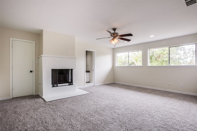 unfurnished living room with ceiling fan and carpet floors