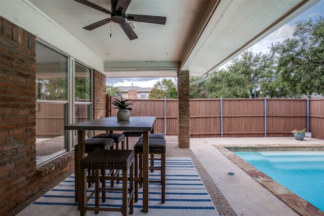 view of pool with a patio area and ceiling fan