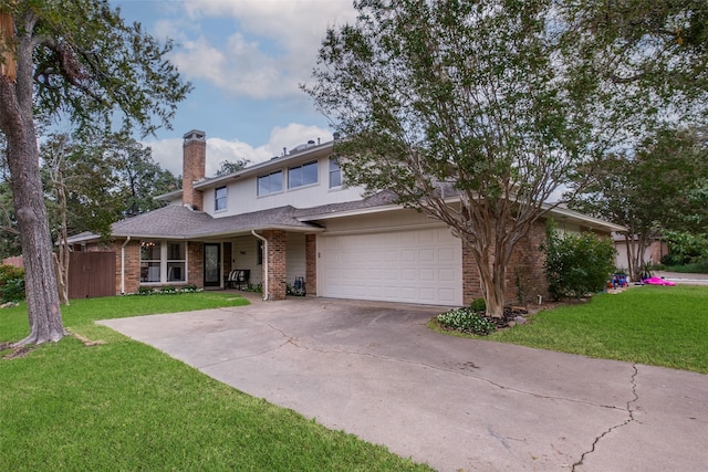 view of front of property featuring a garage and a front yard