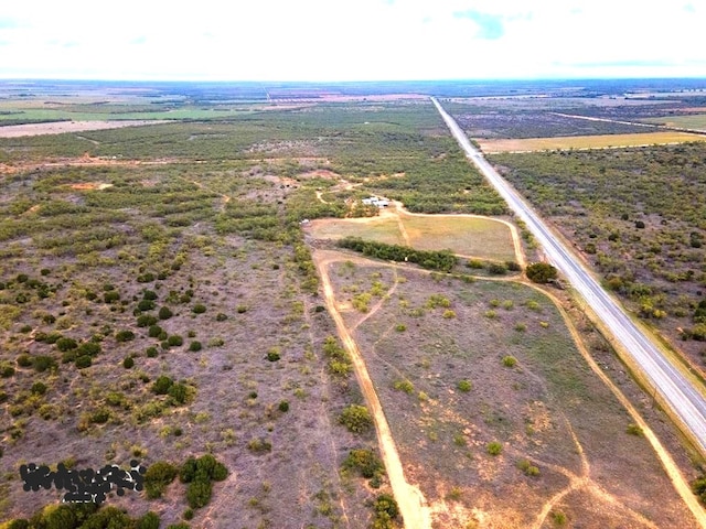 birds eye view of property with a rural view