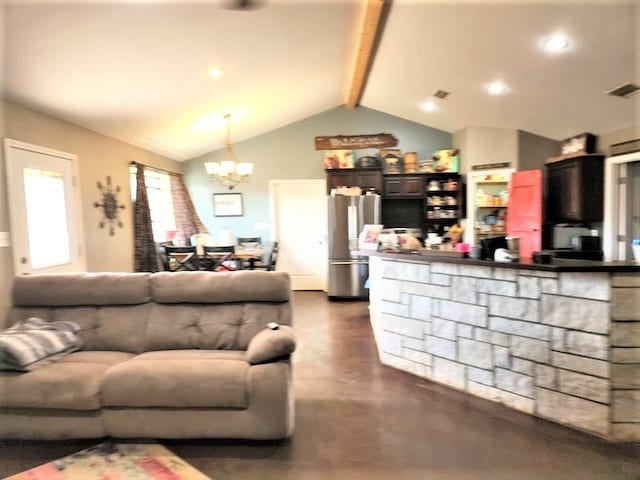 living room featuring a chandelier and vaulted ceiling with beams