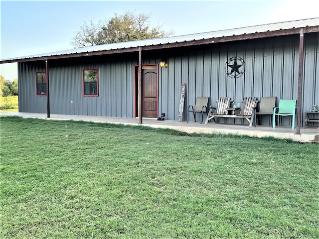 view of outbuilding with a lawn