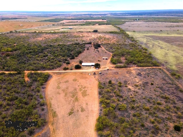 birds eye view of property with a rural view