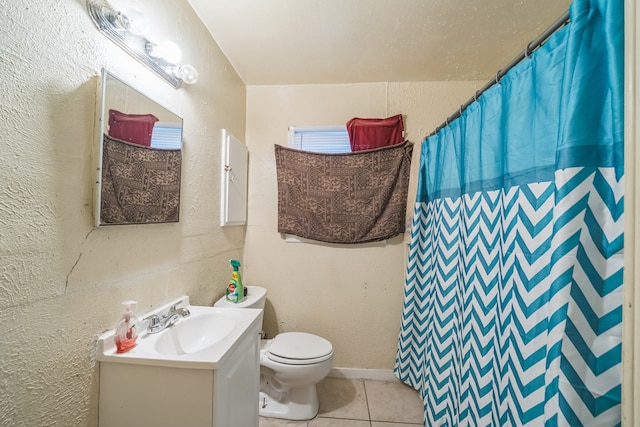 bathroom featuring vanity, curtained shower, toilet, and tile patterned floors