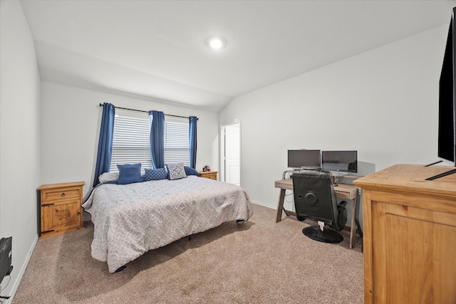 carpeted bedroom featuring vaulted ceiling