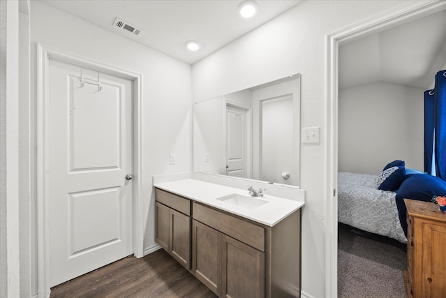 bathroom featuring vanity and hardwood / wood-style floors