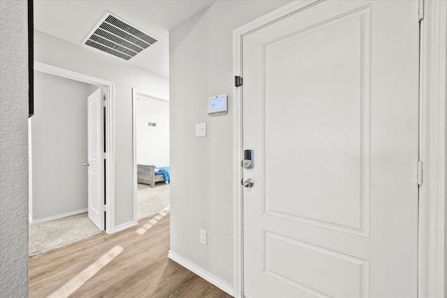 hallway with light wood-type flooring