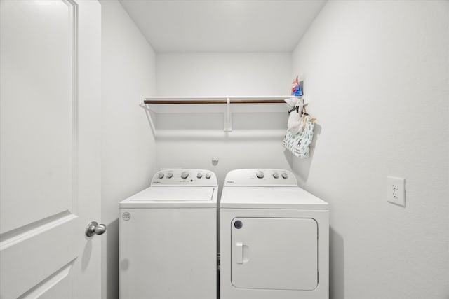 laundry area with washing machine and dryer