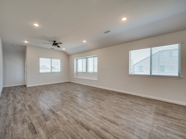 empty room featuring recessed lighting, visible vents, baseboards, and wood finished floors