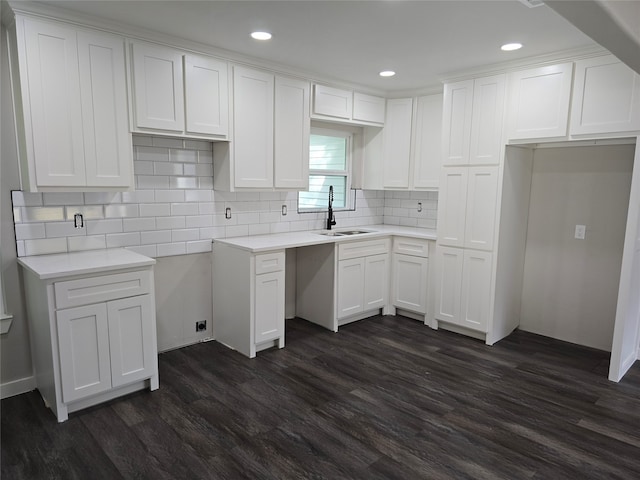 kitchen with sink, white cabinets, and dark hardwood / wood-style floors