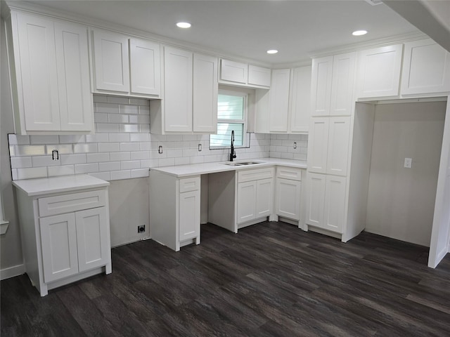 3107 51st St, Dallas, TX 75216 - kitchen with a sink, dark wood-style floors, white cabinetry, backsplash, and recessed lighting