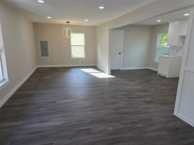3107 51st St, Dallas, TX 75216 - spare room featuring electric panel, recessed lighting, dark wood-style floors, and baseboards
