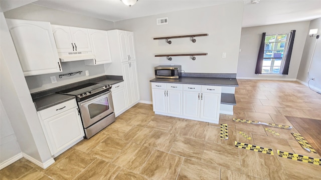 kitchen featuring appliances with stainless steel finishes and white cabinets