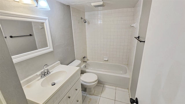 full bathroom with vanity, toilet, tiled shower / bath combo, and tile patterned flooring