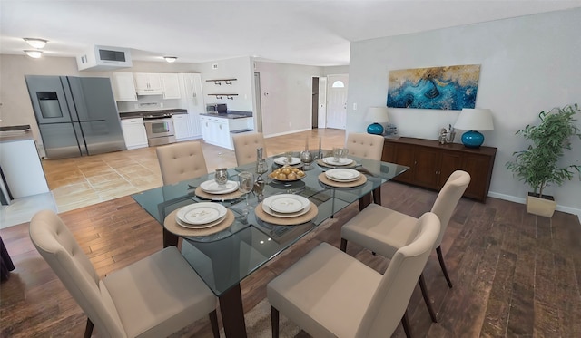 dining area with light wood-type flooring