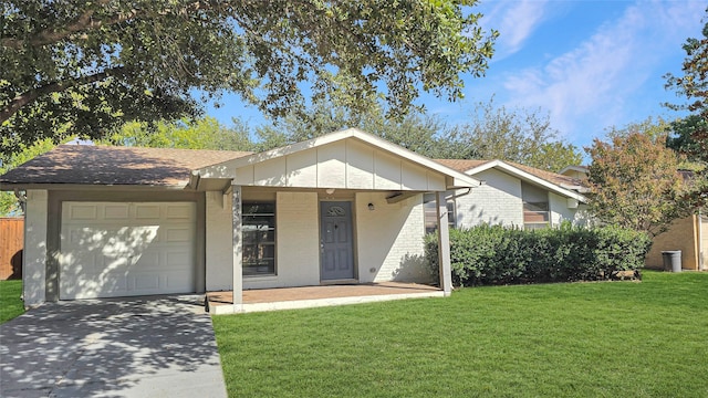 single story home with a front yard and a garage