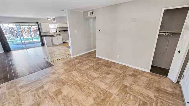 unfurnished living room with light wood-type flooring