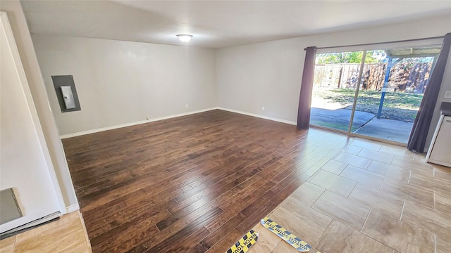 unfurnished room with light hardwood / wood-style floors