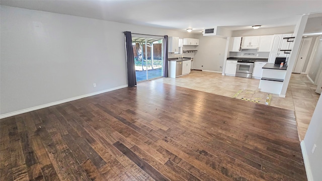 unfurnished living room featuring light wood-type flooring