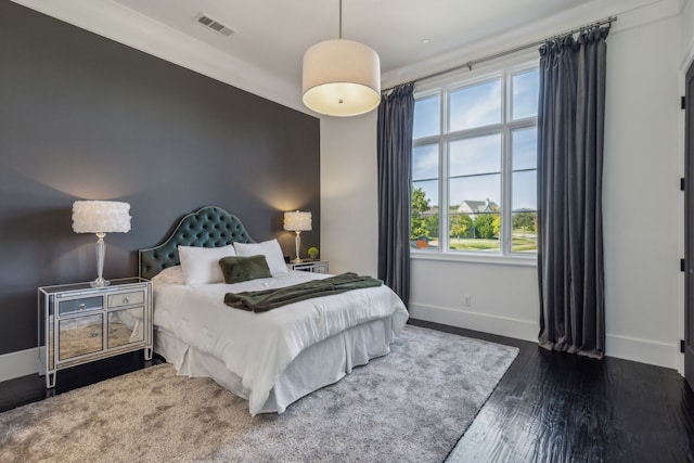 bedroom featuring dark hardwood / wood-style flooring