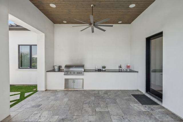 view of patio / terrace with an outdoor kitchen, grilling area, and ceiling fan