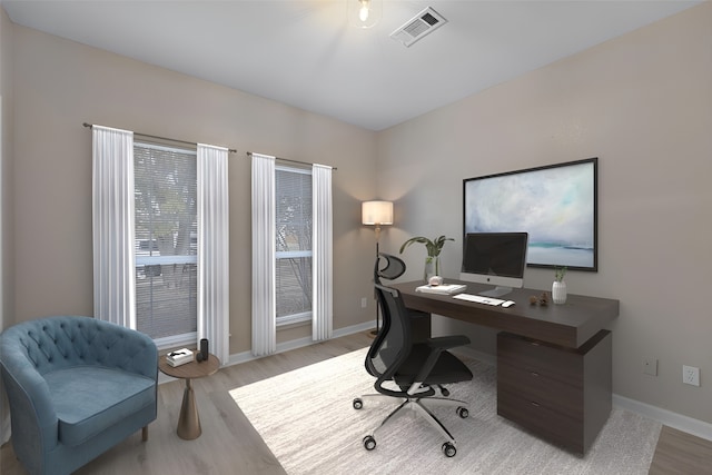 office area with light hardwood / wood-style flooring