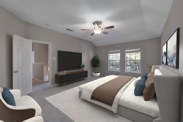 carpeted bedroom featuring ceiling fan and vaulted ceiling