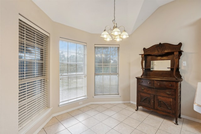 tiled dining room featuring vaulted ceiling and a notable chandelier